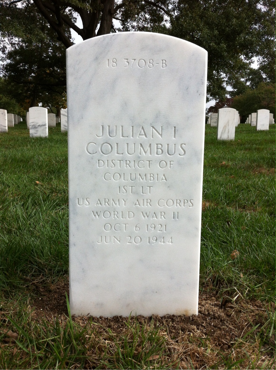 Headstone shared by 2 interments, including Julian I Columbus