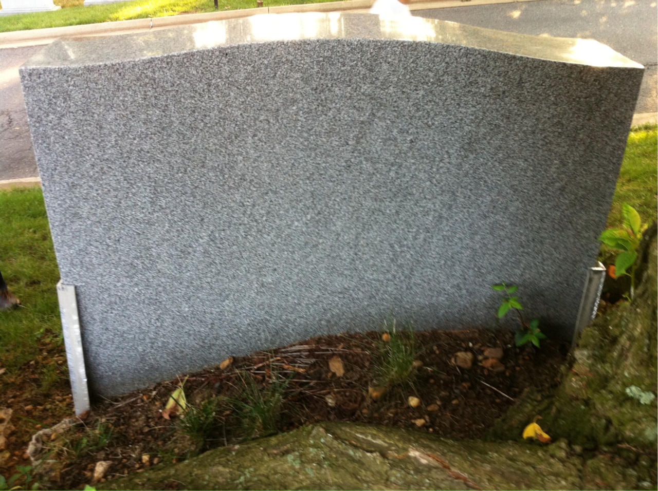 Headstone shared by 2 interments, including Clinton A Misson