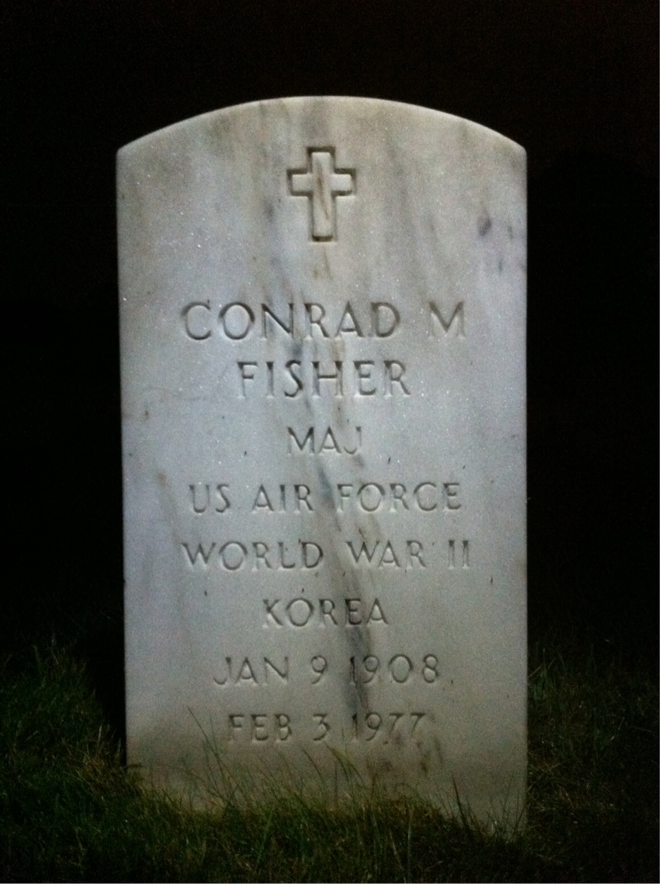 Headstone shared by 2 interments, including Conrad M Fisher