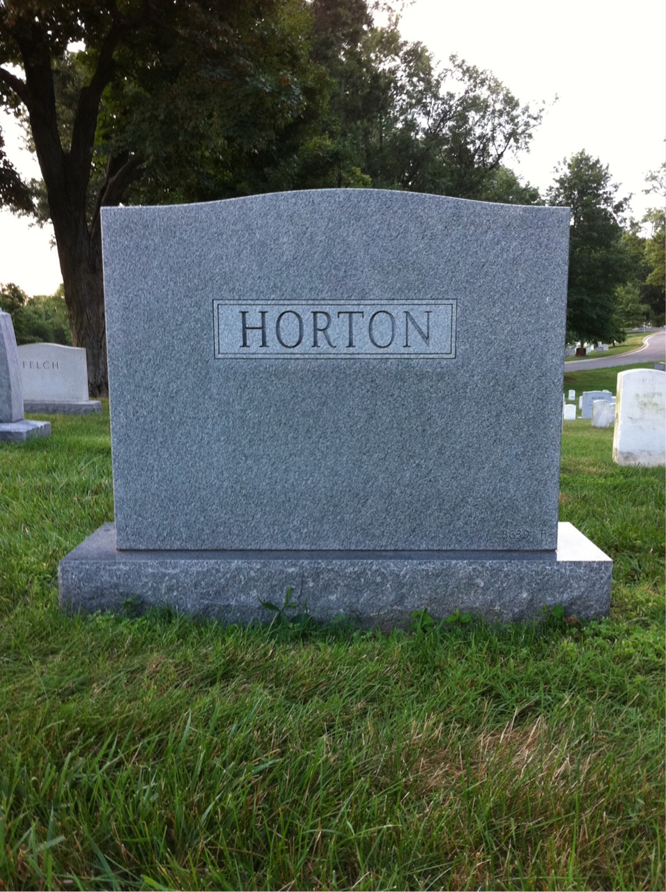 Headstone shared by 2 interments, including John B Horton