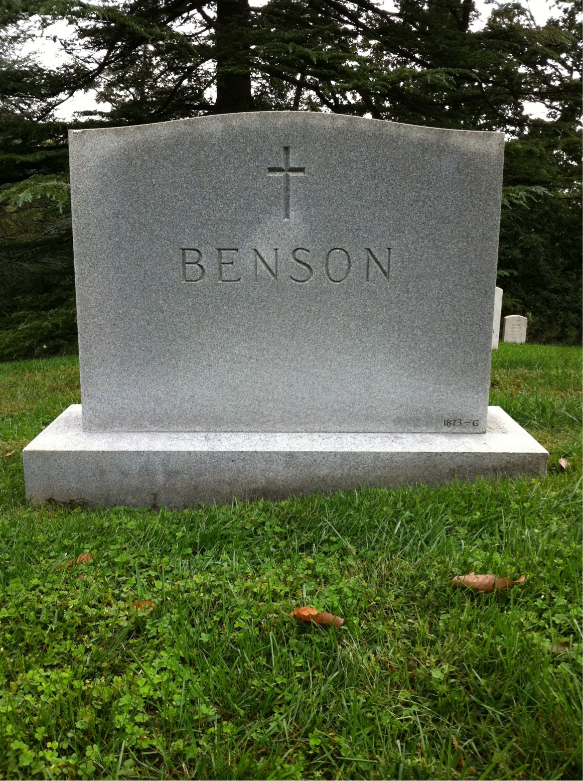 Headstone shared by 2 interments, including Howard H Benson