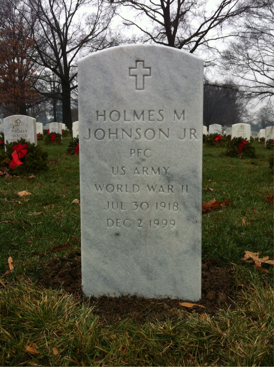 Headstone shared by 2 interments, including Holmes M Johnson Jr.