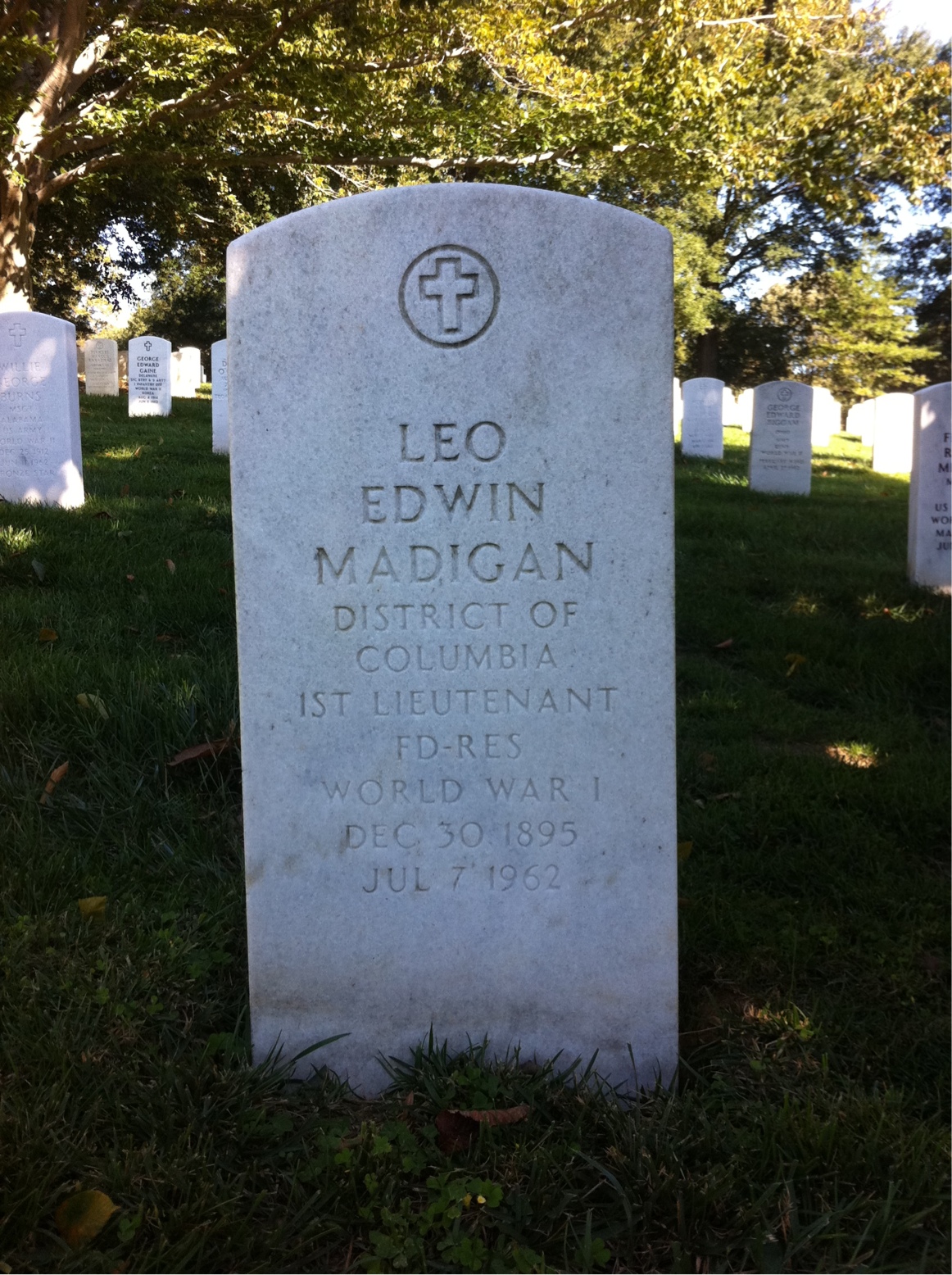 Headstone shared by 2 interments, including Leo E Madigan