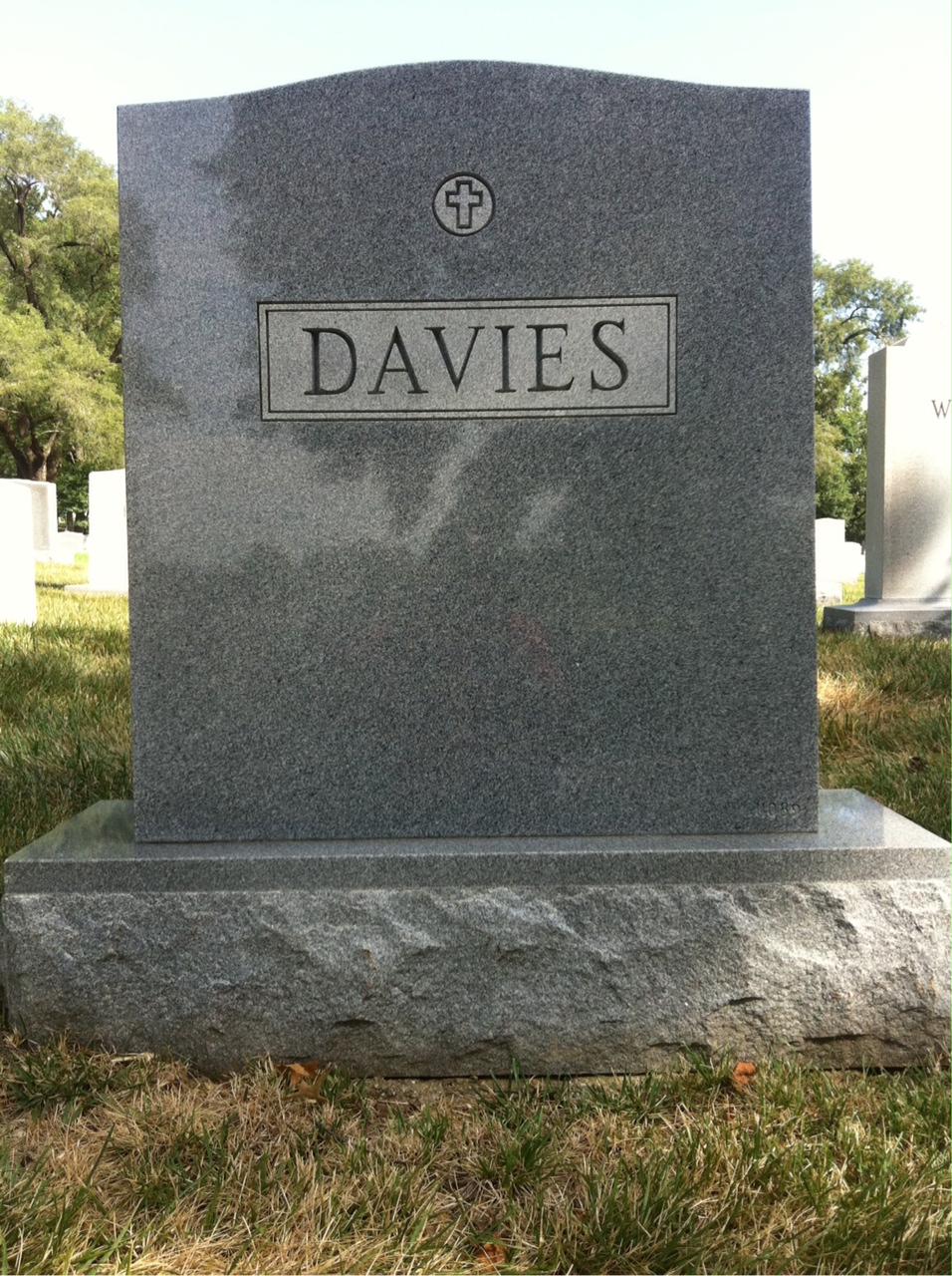Headstone shared by 3 interments, including Dennis F Davies