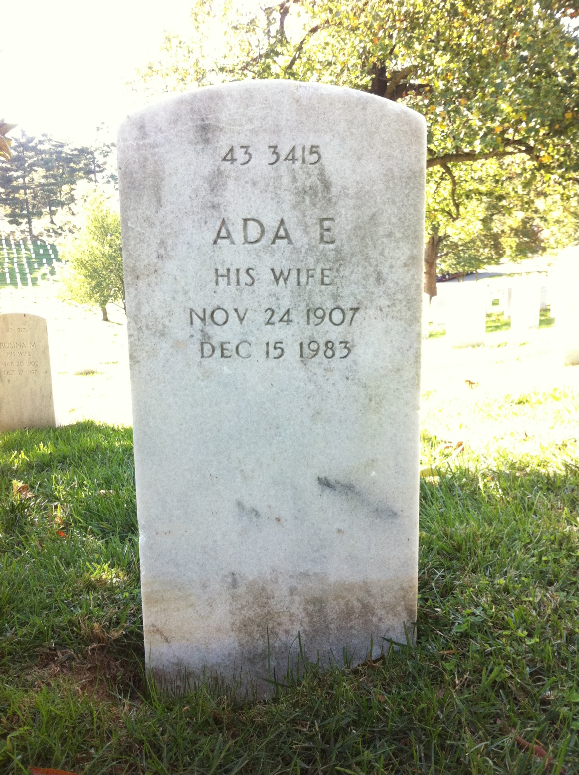 Headstone shared by 2 interments, including Leo E Madigan