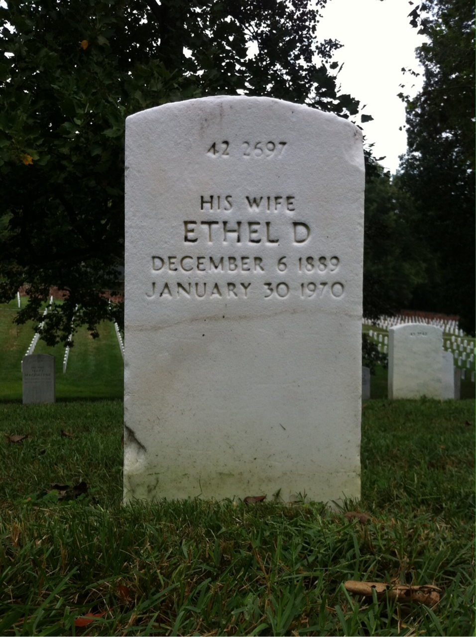 Headstone shared by 2 interments, including Everett J Warner
