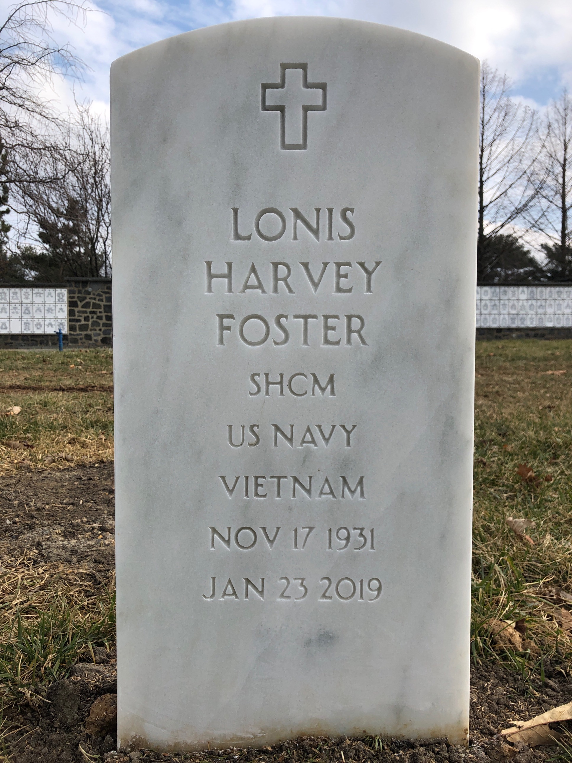 Headstone shared by 2 interments, including Lonis Harvey Foster